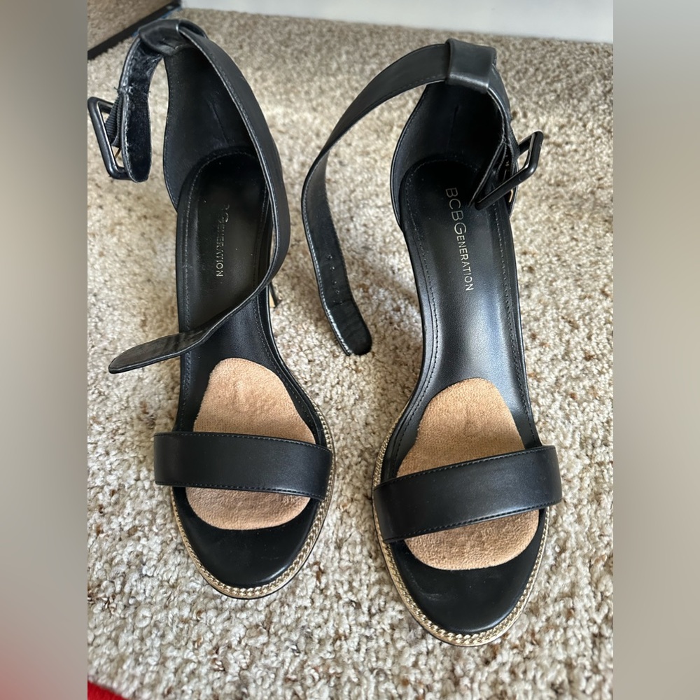 Black open till heels with gold studs